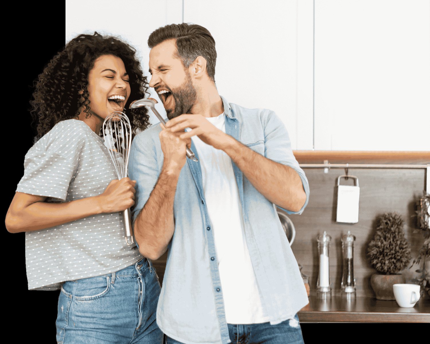 Happy couple cooking in a modern kitchen with quality kitchen warehouse products
